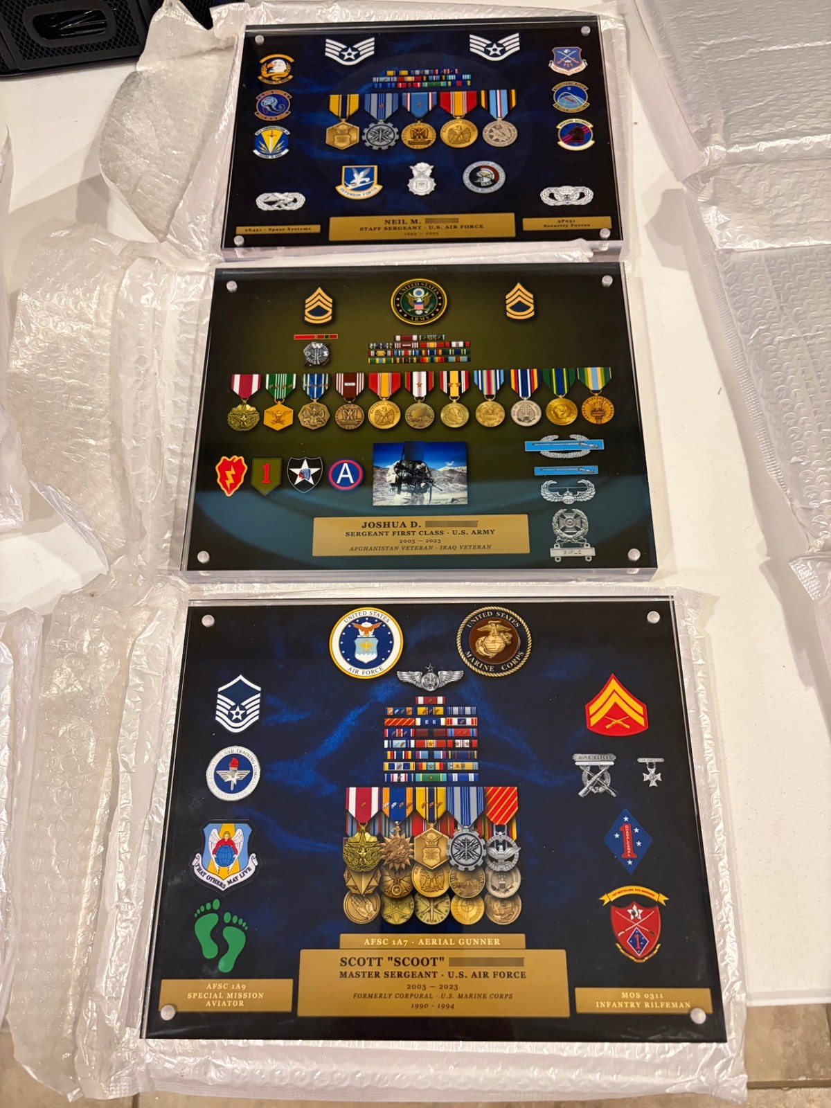 Three finished acrylic Valor Blocks for Air Force and Army veterans, packed for shipping